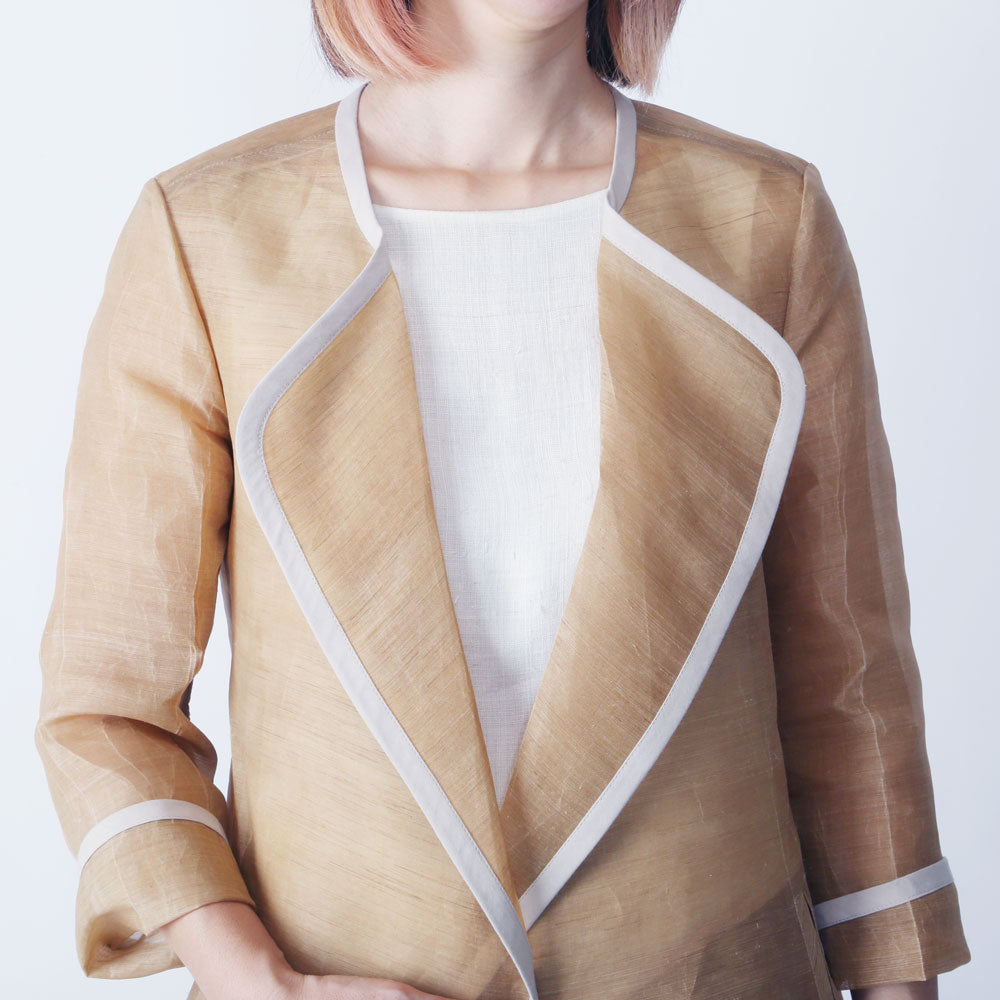 Woman in a lacquered jacket