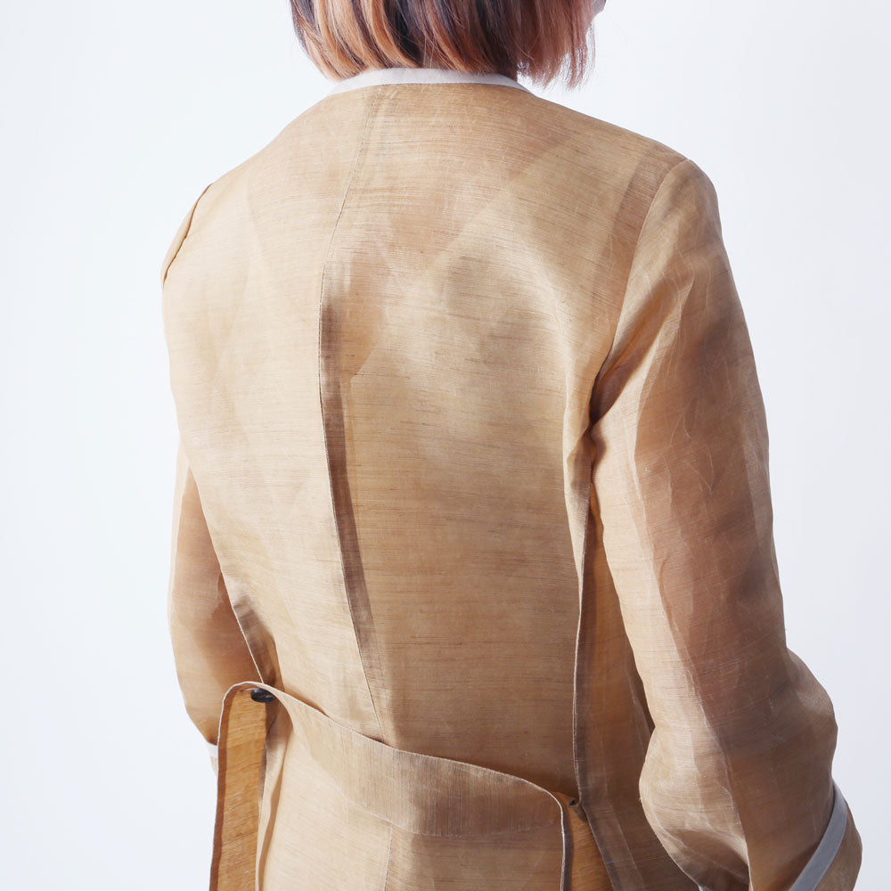 Woman in a lacquered jacket
